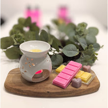 Load image into Gallery viewer, Scented wax melts arranged on a table for home aromatherapy
